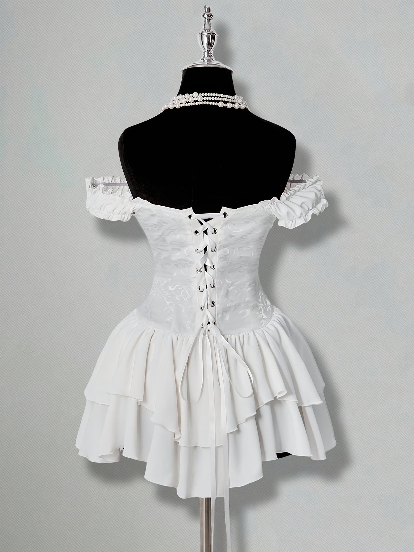 One-Shoulder Dress with a Fitted Waist And Back Tie, Features Puff Sleeves And a Stylish, Elegant Cake Skirt