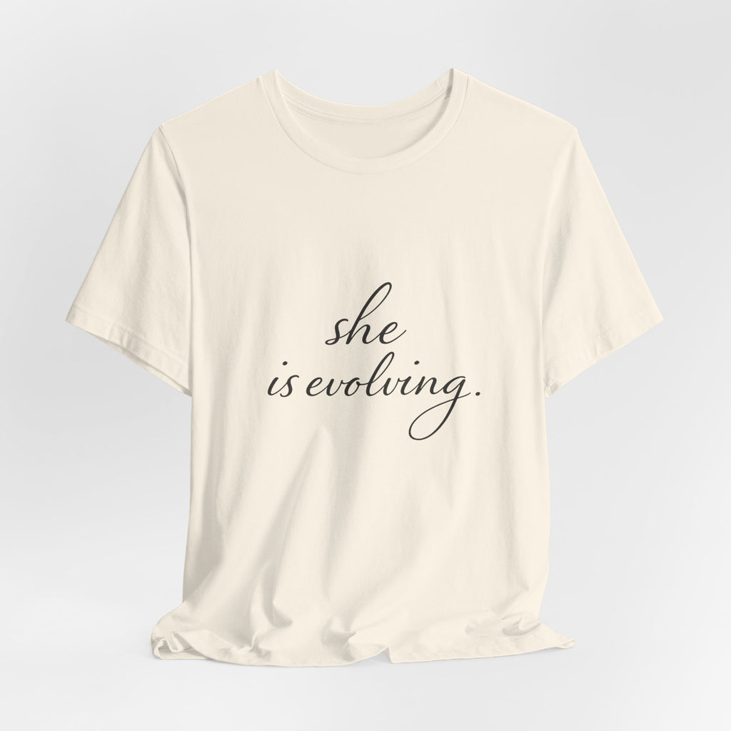 She Is Evolving Tee — Feminine Script Inspirational T-Shirt