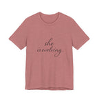 She Is Evolving Tee — Feminine Script Inspirational T-Shirt