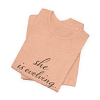 She Is Evolving Tee — Feminine Script Inspirational T-Shirt