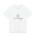 She Is Evolving Tee — Feminine Script Inspirational T-Shirt