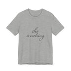 She Is Evolving Tee — Feminine Script Inspirational T-Shirt