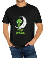 Person wearing a black t-shirt with an alien graphic and 'I Need More Space' text.