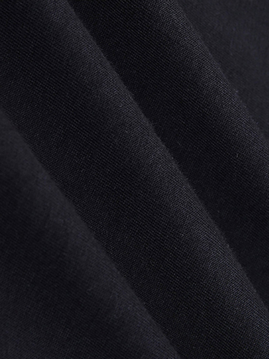 Close-up of black fabric with a textured pattern