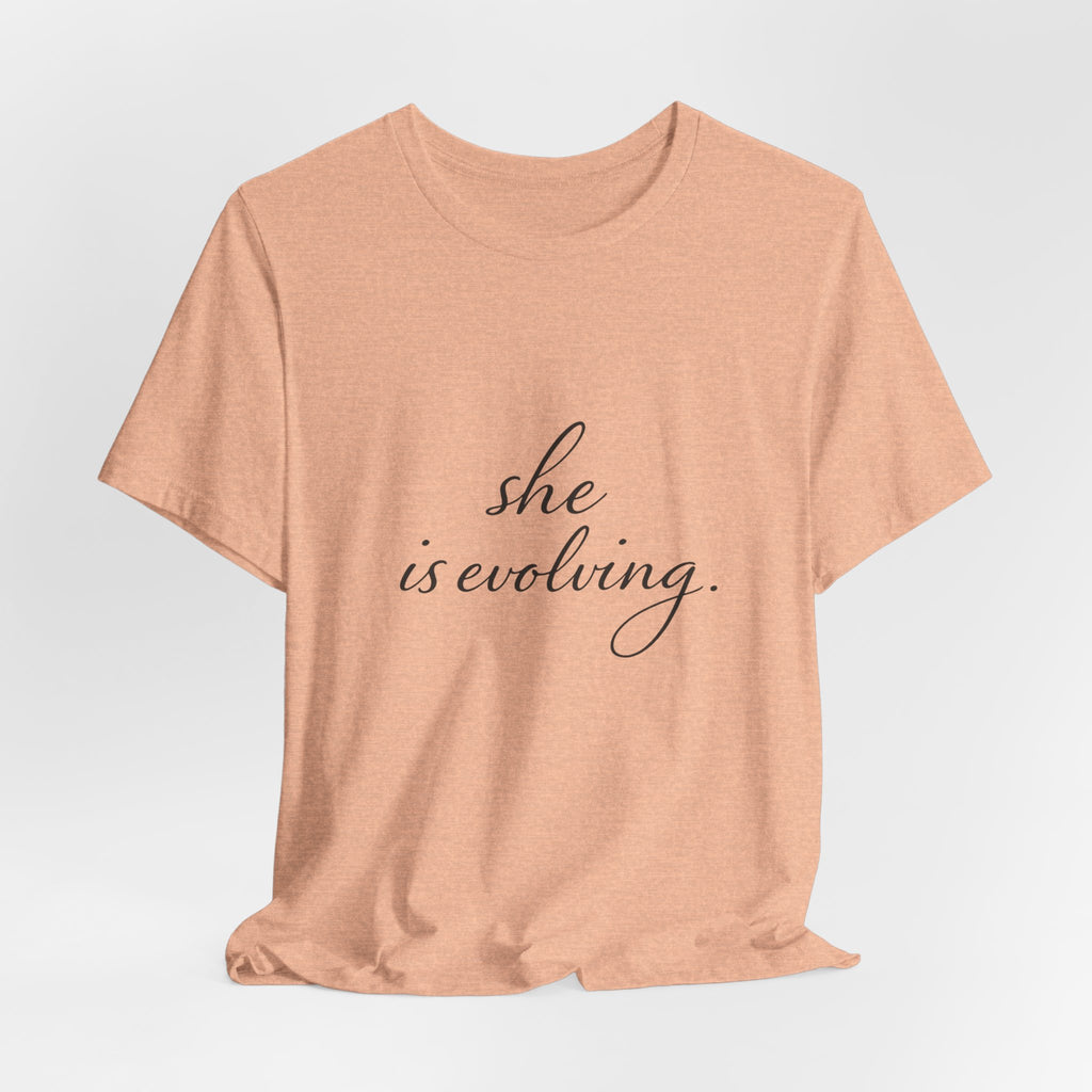 She Is Evolving Tee — Feminine Script Inspirational T-Shirt