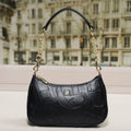Embossed Letter Dumpling Crossbody Bag