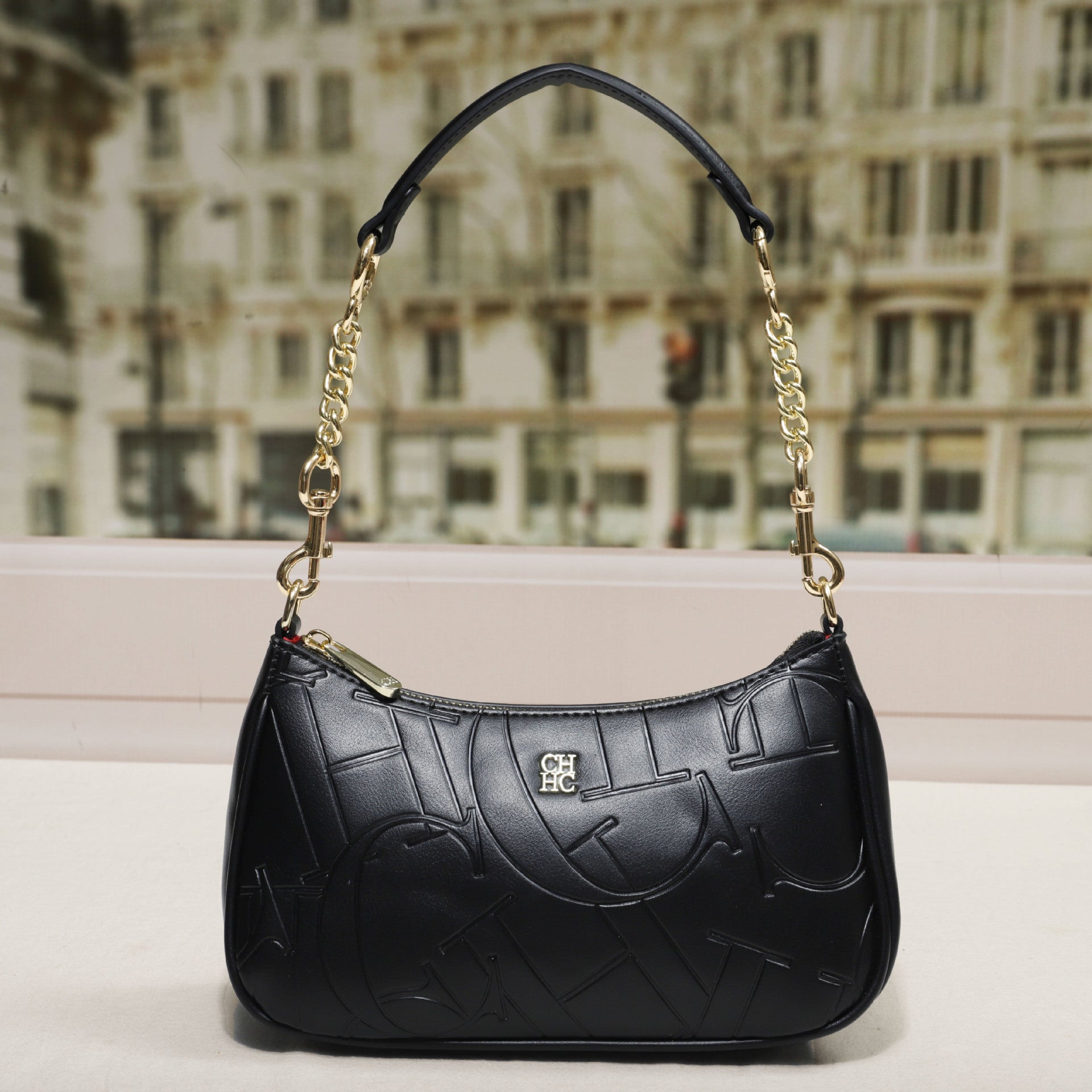 Embossed Letter Dumpling Crossbody Bag