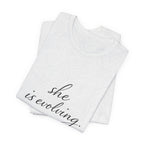 She Is Evolving Tee — Feminine Script Inspirational T-Shirt