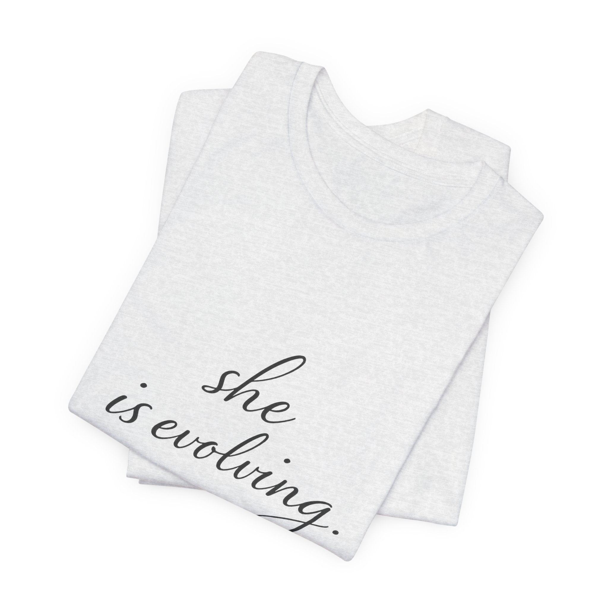 She Is Evolving Tee — Feminine Script Inspirational T-Shirt