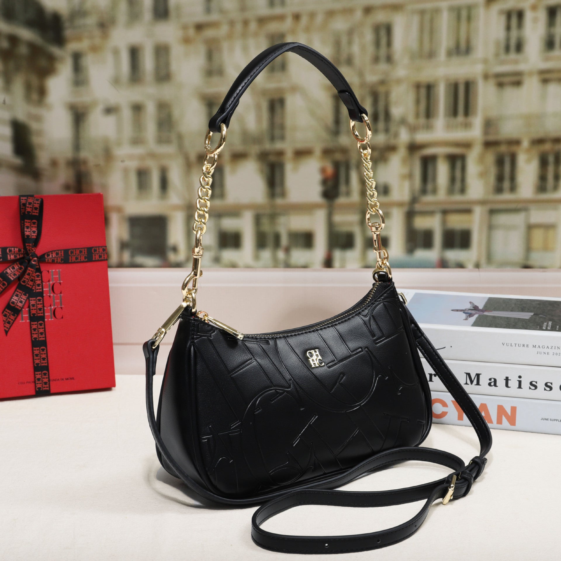 Embossed Letter Dumpling Crossbody Bag