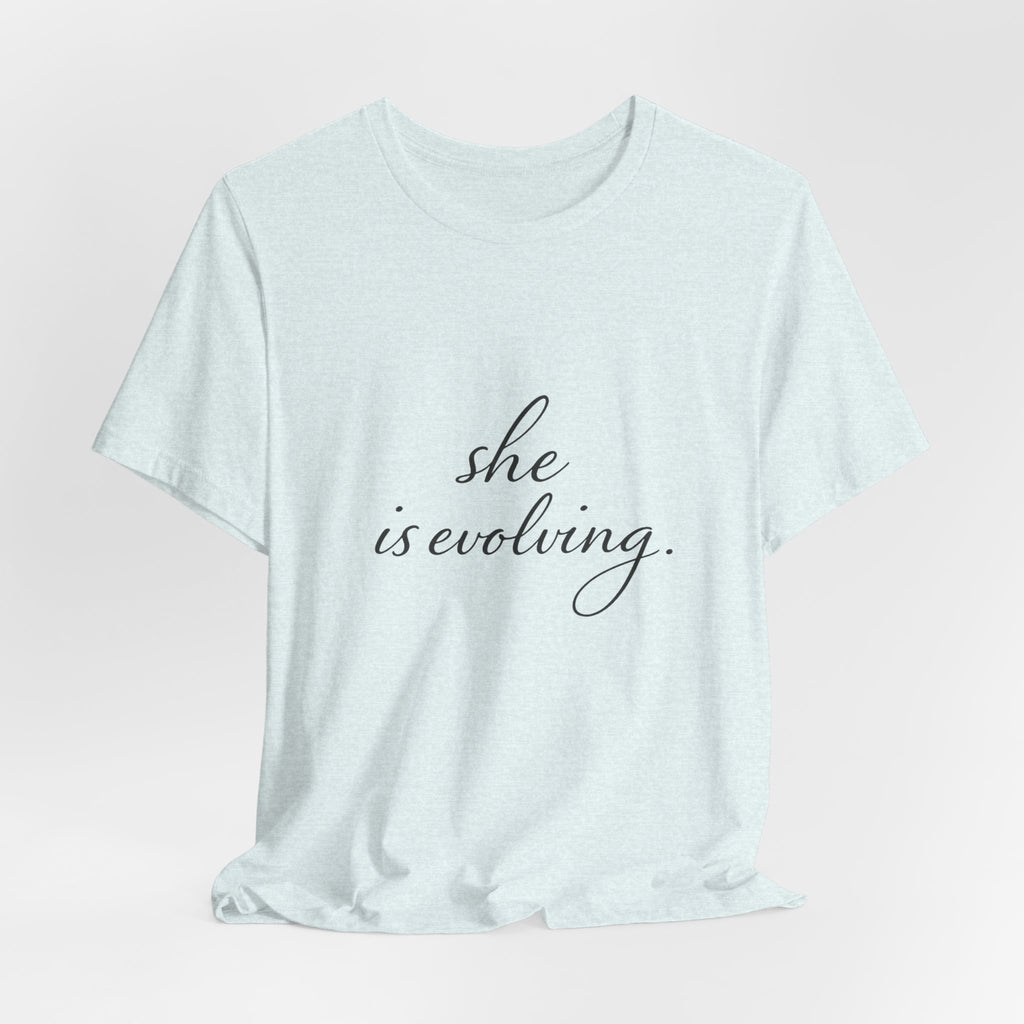 She Is Evolving Tee — Feminine Script Inspirational T-Shirt