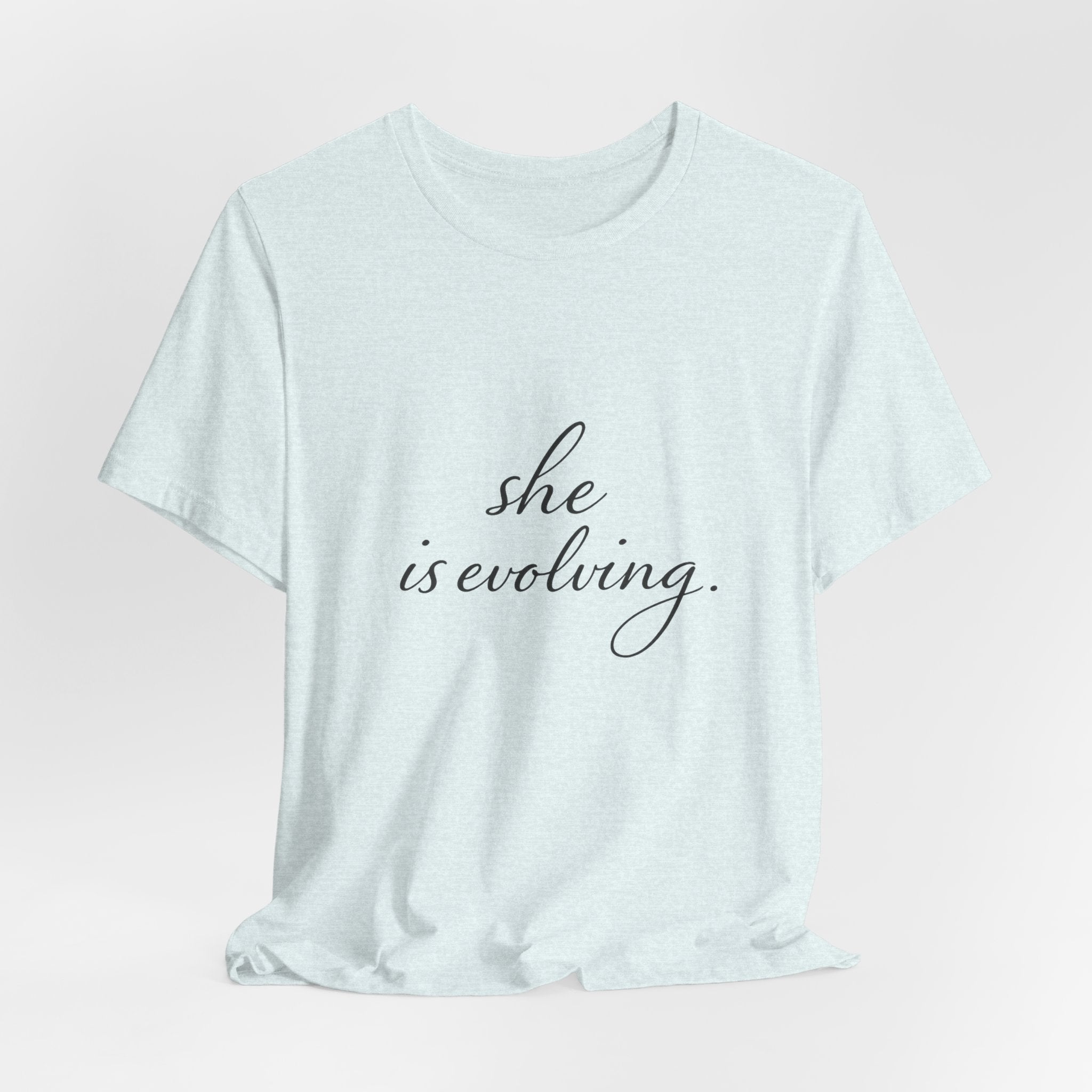 She Is Evolving Tee — Feminine Script Inspirational T-Shirt