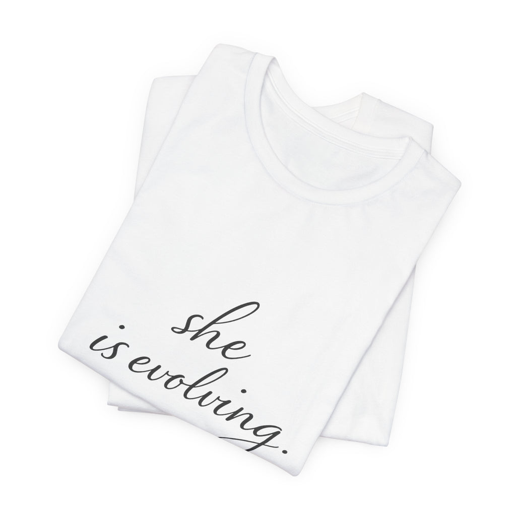 She Is Evolving Tee — Feminine Script Inspirational T-Shirt