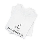 She Is Evolving Tee — Feminine Script Inspirational T-Shirt
