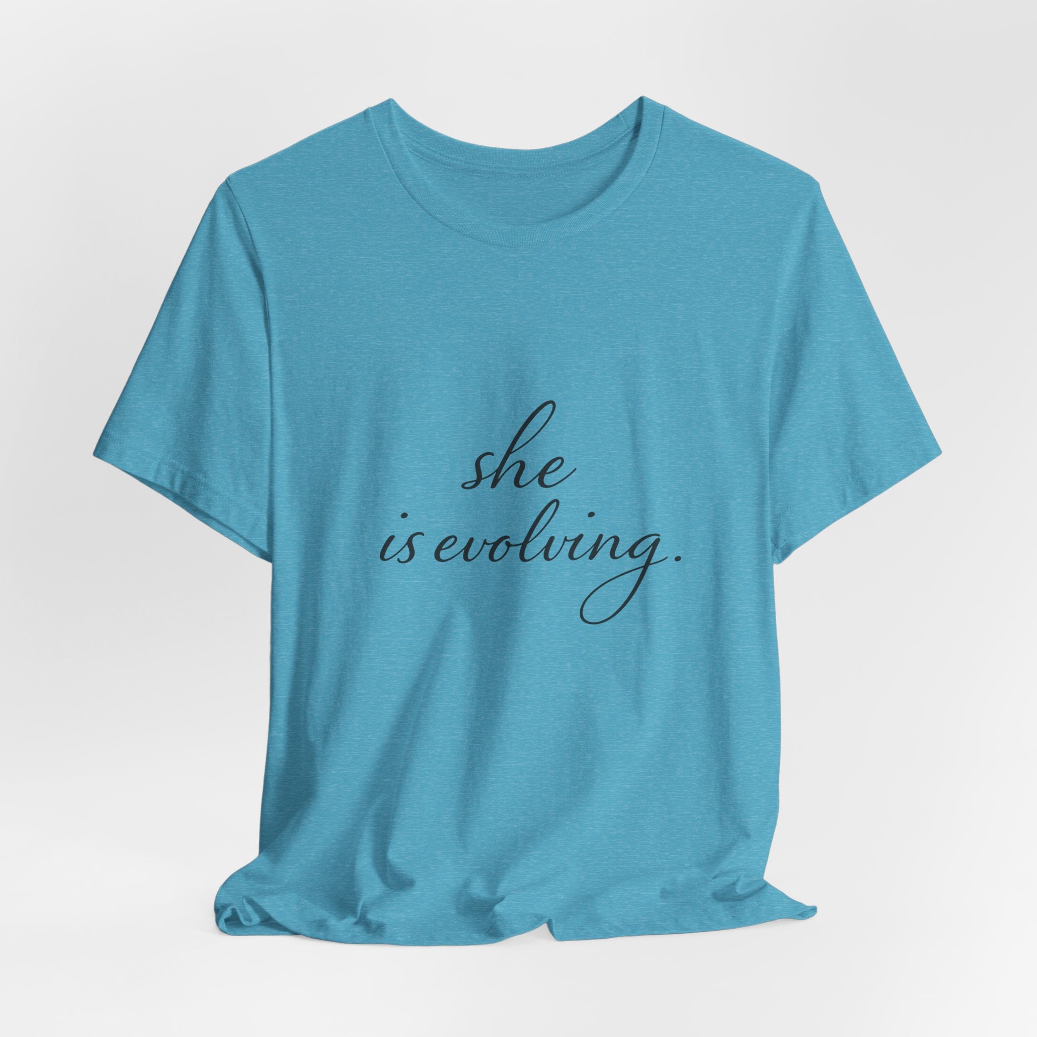 She Is Evolving Tee — Feminine Script Inspirational T-Shirt
