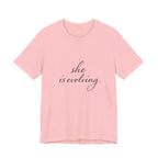 She Is Evolving Tee — Feminine Script Inspirational T-Shirt