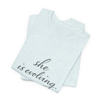 She Is Evolving Tee — Feminine Script Inspirational T-Shirt