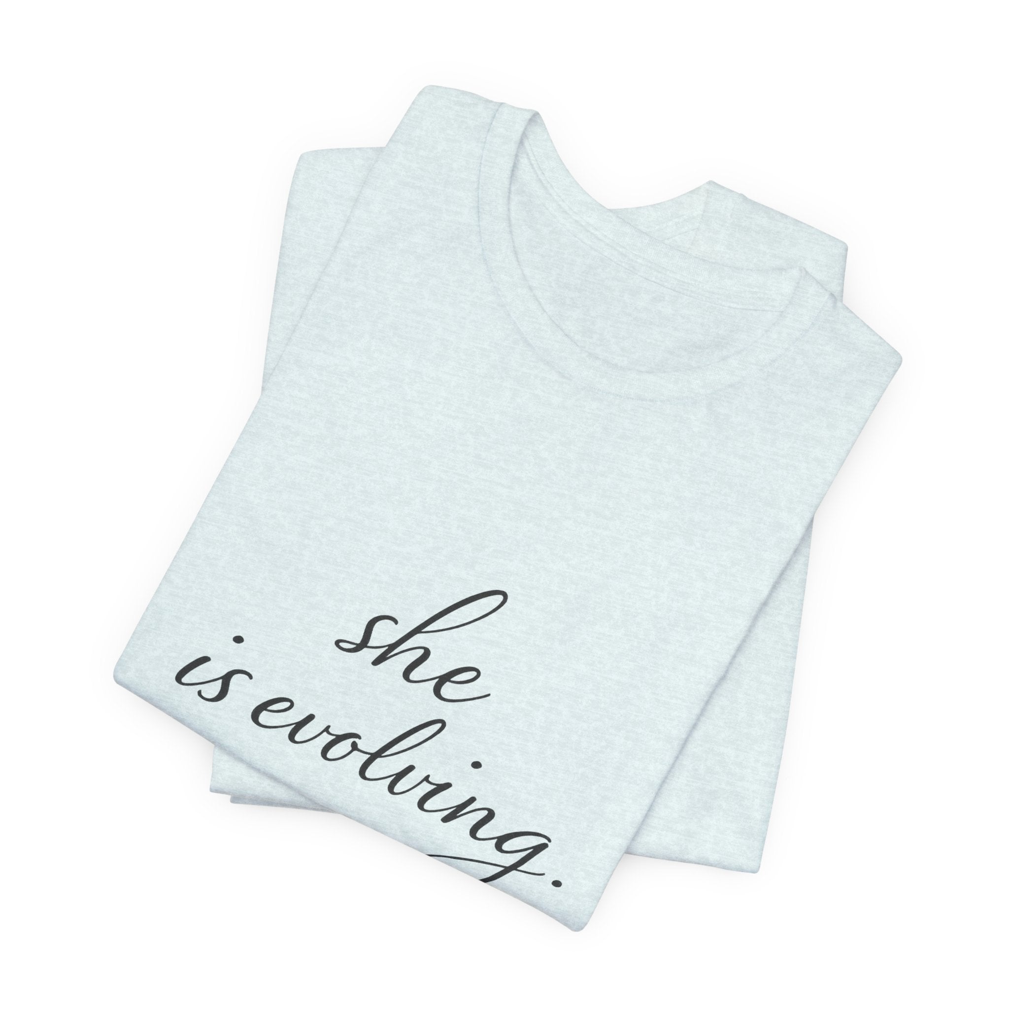 She Is Evolving Tee — Feminine Script Inspirational T-Shirt