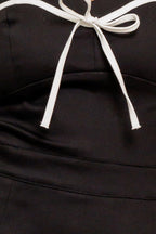 NOIR BOW COUTURE WOVEN SKORT ROMPER