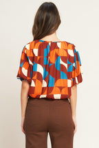GONE IN A BLINK WOVEN TOP