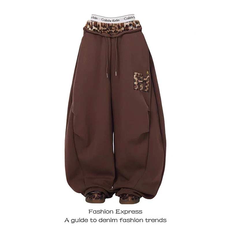 Brown baggy pants with leopard print details on a white background - Winstar Marketing