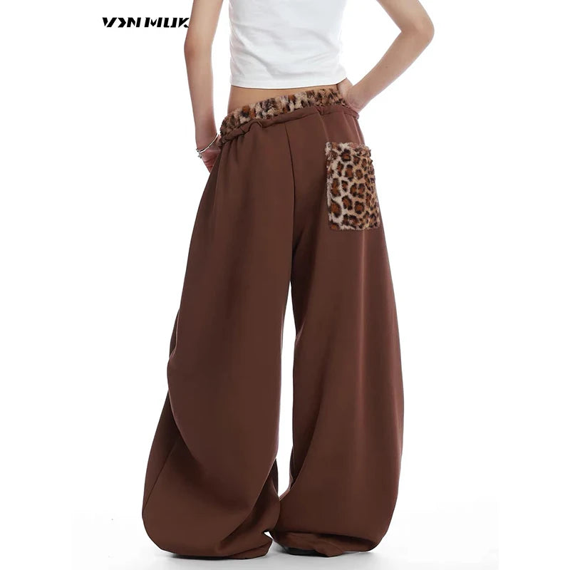 Brown baggy pants with leopard print details on a white background - Winstar Marketing
