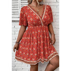 Orange Plus Size Printed Surplice Neck Empire Waist Flowy Mini Dress
