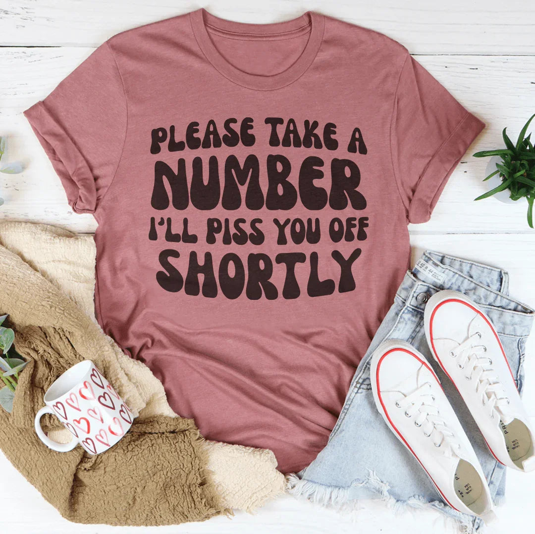"Please Take A Number I'll Piss You Off Shortly" – Relatable Sarcasm Graphic Shirt